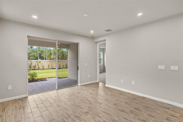 20405 Symphony Pl, Venice, FL 34293 - spare room with recessed lighting, visible vents, light wood-type flooring, and baseboards
