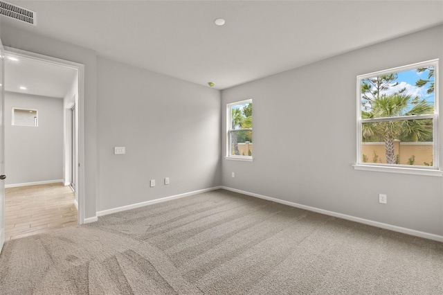 20405 Symphony Pl, Venice, FL 34293 - carpeted empty room featuring visible vents, baseboards, and recessed lighting