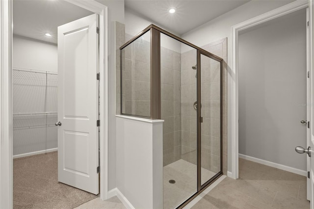 20405 Symphony Pl, Venice, FL 34293 - full bathroom featuring a walk in closet, baseboards, a shower stall, and recessed lighting