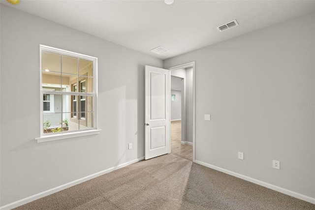 20405 Symphony Pl, Venice, FL 34293 - carpeted empty room with visible vents and baseboards