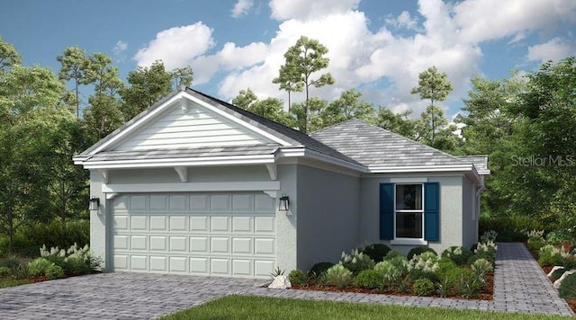 view of front of property featuring a garage, decorative driveway, and stucco siding