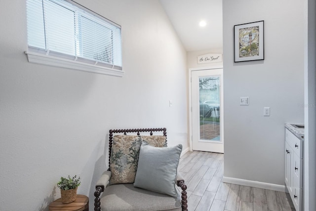 living area with wood finish floors and baseboards