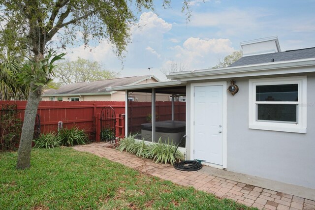 view of yard featuring a fenced backyard and a hot tub