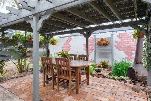 view of patio / terrace featuring outdoor dining space and a pergola