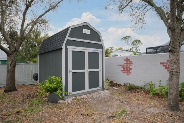 view of shed with a fenced backyard