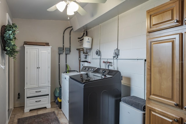 washroom featuring washing machine and dryer, cabinet space, and ceiling fan