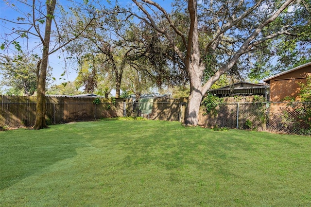 view of yard with a fenced backyard