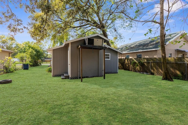 view of yard with an outbuilding and fence private yard