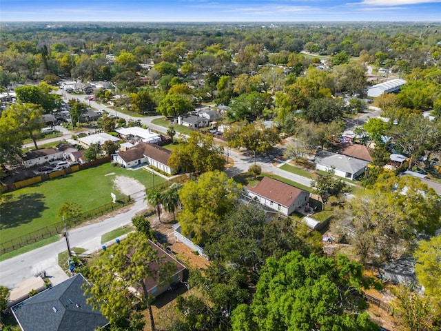 birds eye view of property with a forest view and a residential view