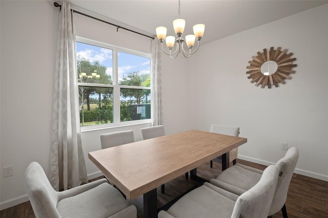 dining room with an inviting chandelier, wood finished floors, and baseboards