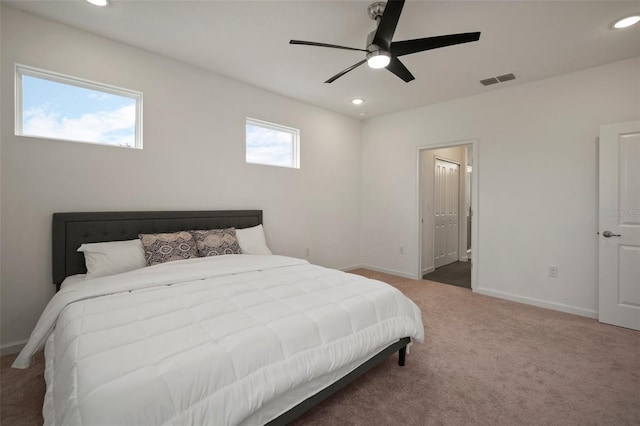 carpeted bedroom featuring visible vents, recessed lighting, a ceiling fan, and baseboards