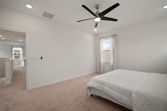 bedroom featuring recessed lighting, baseboards, visible vents, and light carpet