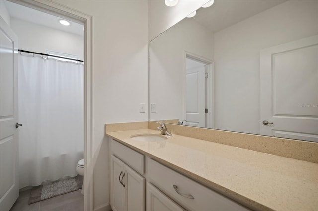 bathroom featuring tile patterned flooring, toilet, vanity, and a shower with curtain