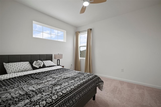 bedroom featuring baseboards, carpet, and a ceiling fan