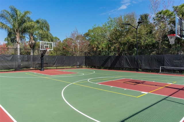 view of sport court featuring community basketball court and fence