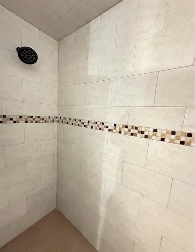 full bathroom with tiled shower