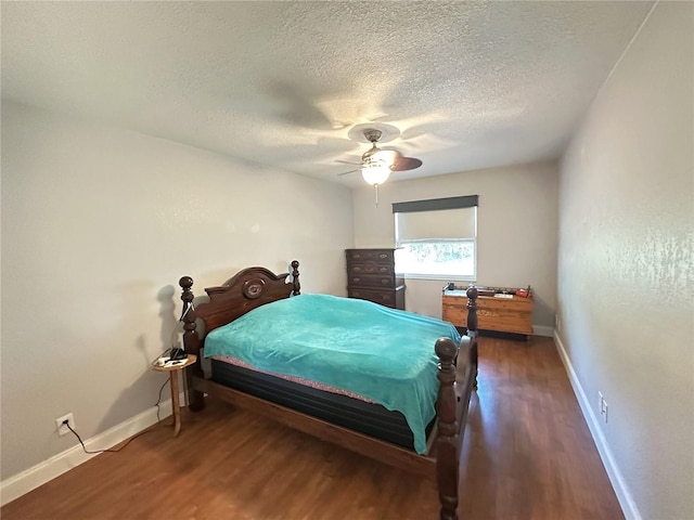 bedroom with baseboards, a textured ceiling, wood finished floors, and a ceiling fan