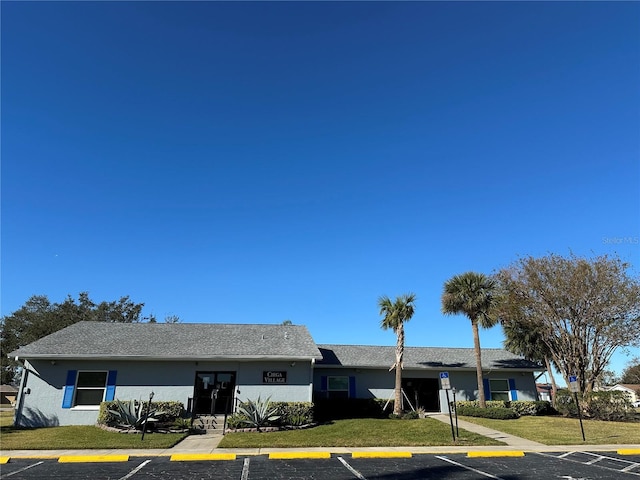 view of property with uncovered parking