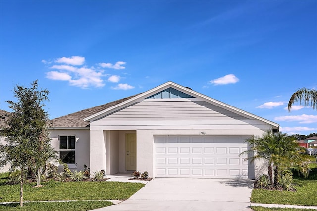 ranch-style home featuring stucco siding, driveway, a shingled roof, a front yard, and an attached garage