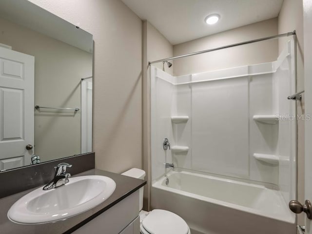 full bath featuring toilet, shower / washtub combination, and vanity