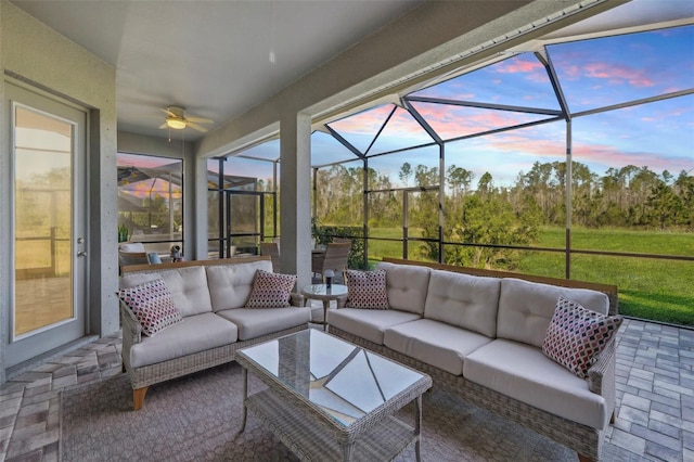 sunroom with a wealth of natural light and ceiling fan