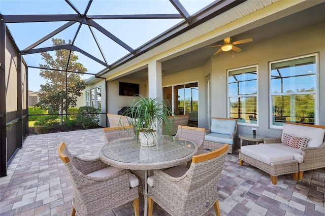 sunroom featuring a ceiling fan