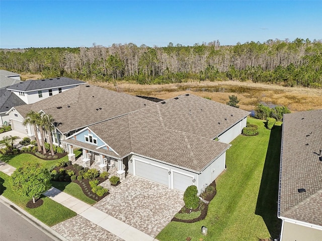 aerial view featuring a wooded view