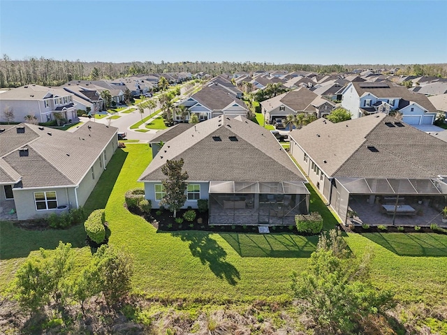 birds eye view of property with a residential view