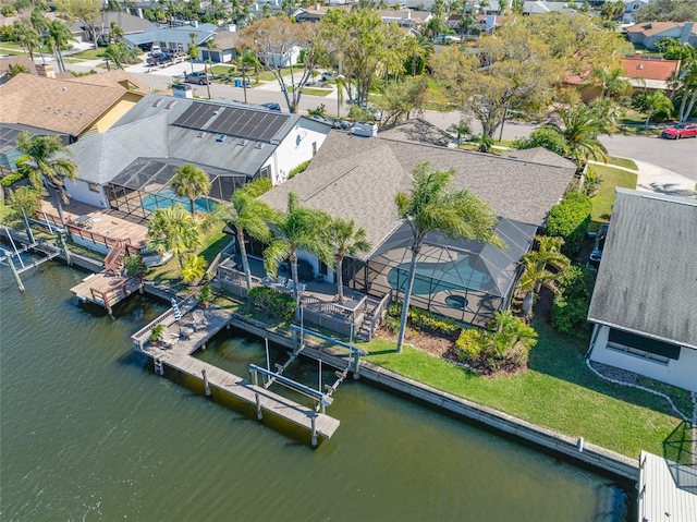 aerial view with a residential view and a water view