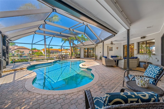 outdoor pool featuring an outdoor living space, a lanai, ceiling fan, and a patio area