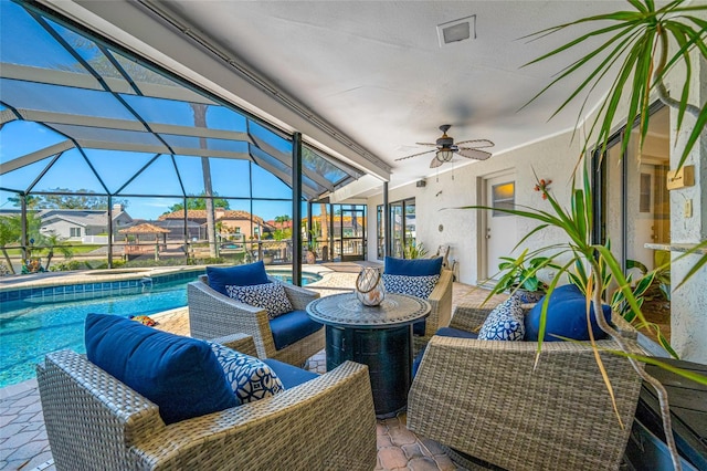 view of patio / terrace featuring an outdoor living space, an outdoor pool, a lanai, and ceiling fan