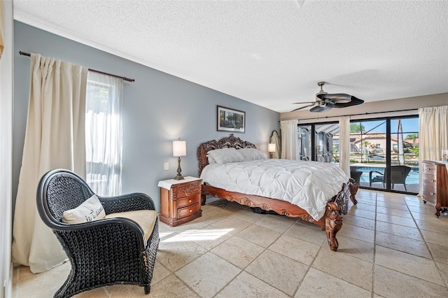 bedroom with multiple windows, a textured ceiling, a ceiling fan, and access to outside