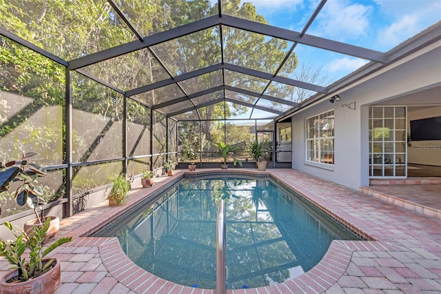 pool featuring a lanai and a patio area