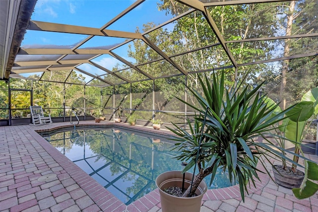 view of pool featuring a patio, a fenced in pool, and a lanai