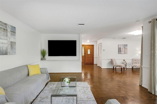 living room featuring visible vents and baseboards