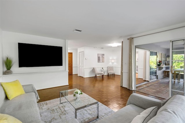 living room featuring visible vents