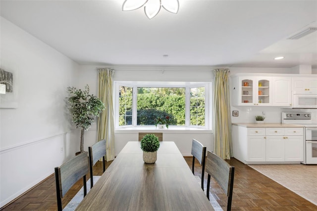 dining room featuring recessed lighting