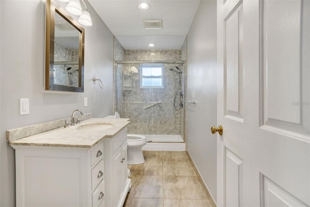 full bath featuring baseboards, toilet, a stall shower, and vanity