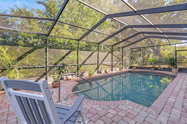 pool with a patio area and a lanai