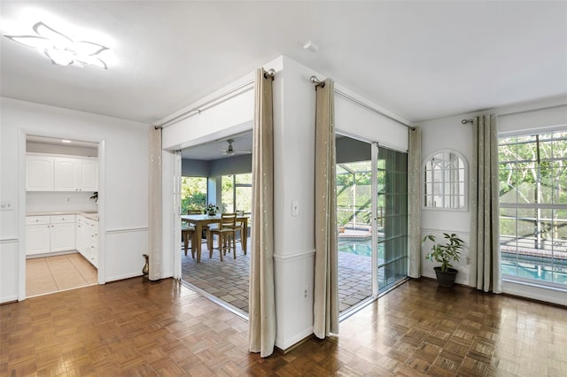 interior space featuring a healthy amount of sunlight and a ceiling fan