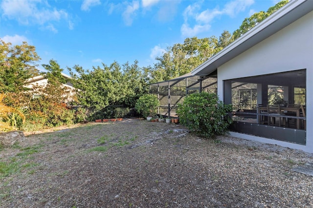 view of yard with a lanai