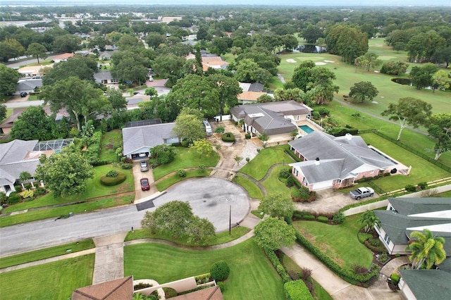 birds eye view of property with a residential view and view of golf course