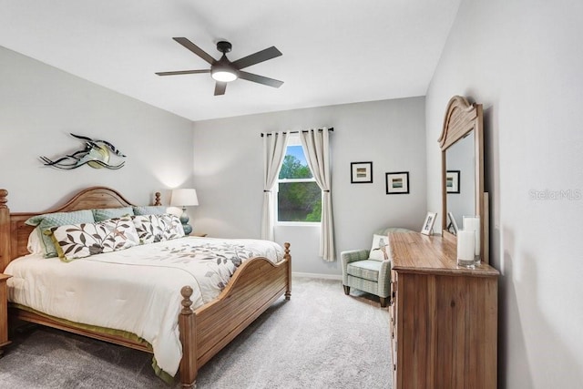 bedroom with a ceiling fan and carpet floors