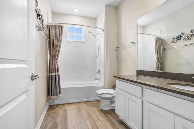 full bath featuring shower / bath combo with shower curtain, toilet, wood finished floors, and vanity