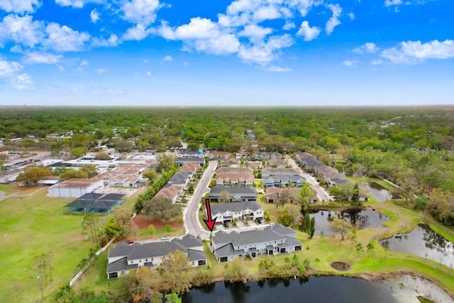 bird's eye view with a wooded view, a water view, and a residential view