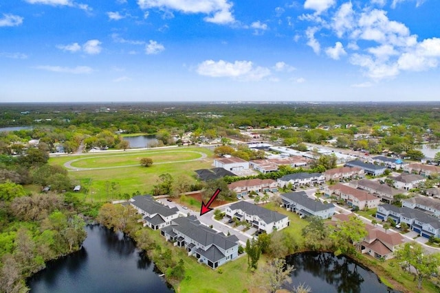 aerial view with a residential view and a water view