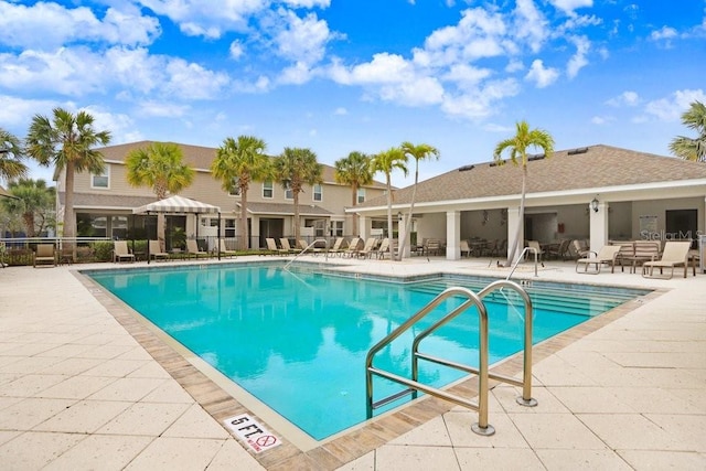 pool featuring a patio area