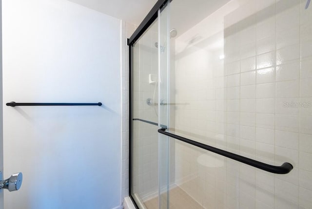 bathroom with a shower stall