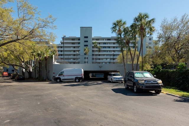 view of building exterior with uncovered parking