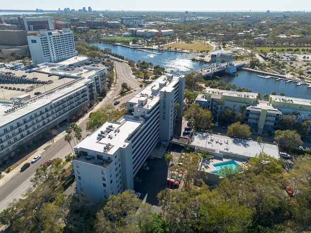 birds eye view of property with a water view and a view of city